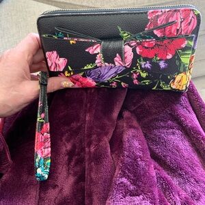 Betsy Johnson clutch wallet multi-color roses, slots for cards, and zipped area.